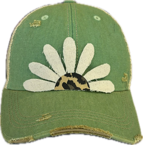 Green cap with a white daisy and leopard print center on a white background