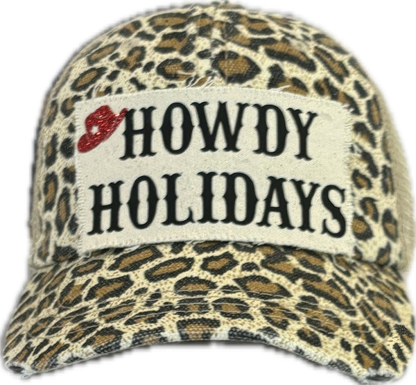 Leopard print cap with 'HOWDY HOLIDAYS' text on a white background