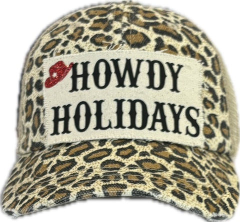Leopard print cap with 'HOWDY HOLIDAYS' text on a white background
